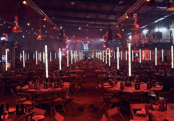 VENUE-FINDING_600 Tables and chairs inside an empty Diecast, one of the leading manchester corporate events venues