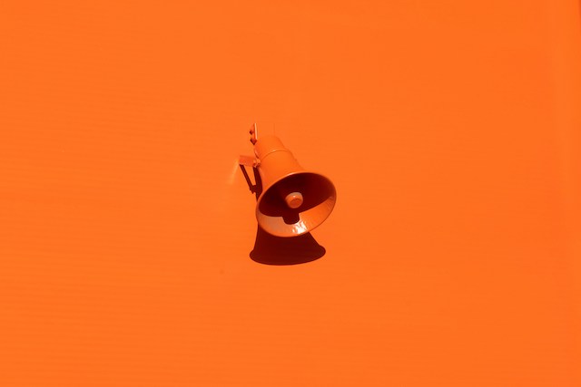 orange megaphone against orange background representing brand activation services